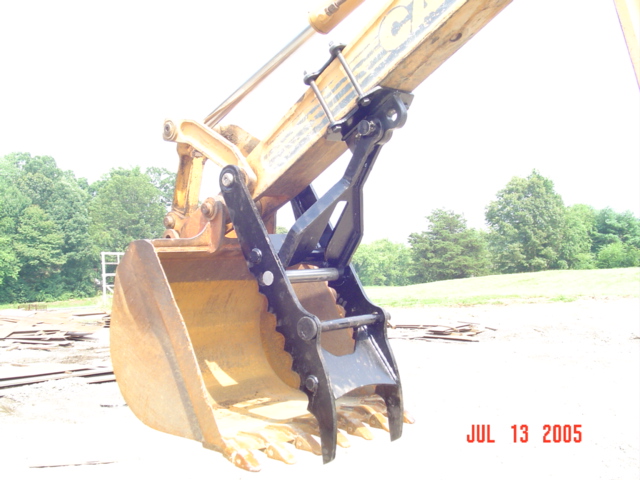 CASE 580 K, L, M with backhoe thumb. Our backhoe thumb just pins on.